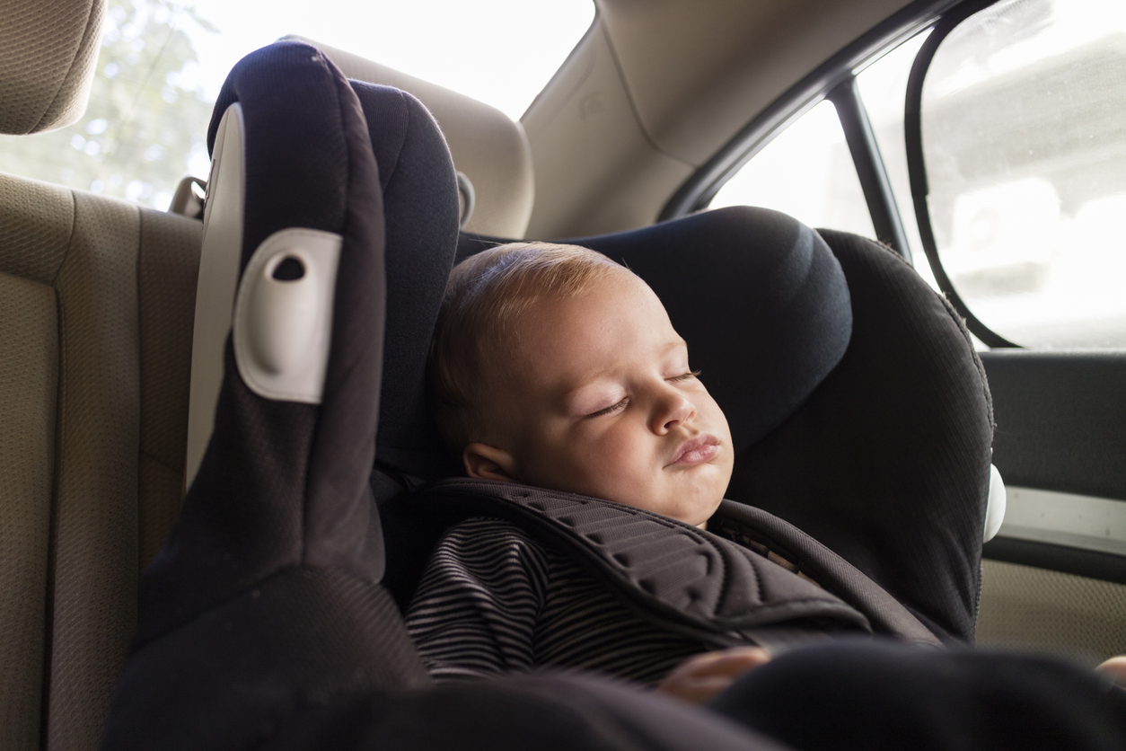 Cute Little Baby Boy Sleeping in Safety Car Seat